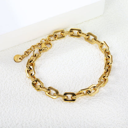 Brazalete Link & Tail Plaque con fusión en Oro 18K