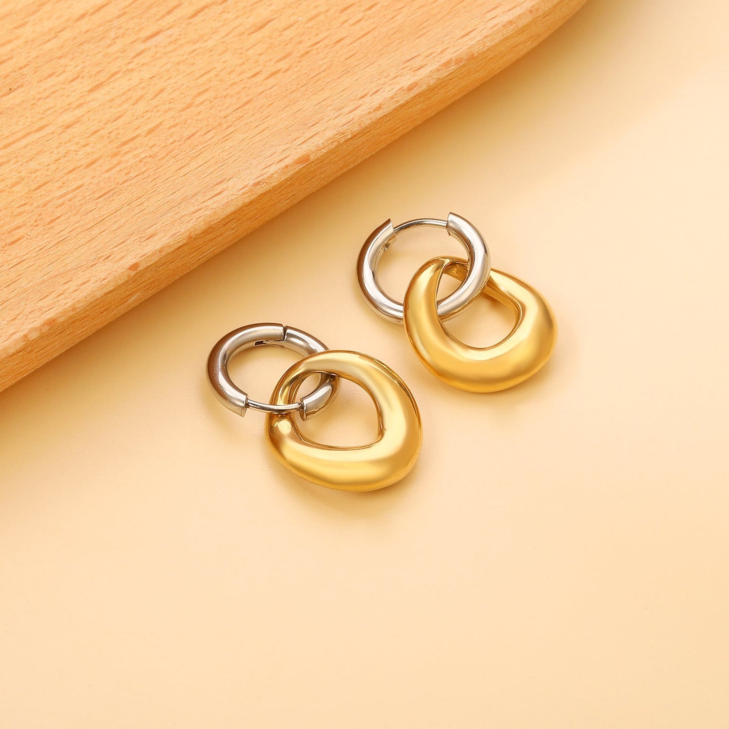 Pendientes Bicolor Orbit con fusión en Oro 18K