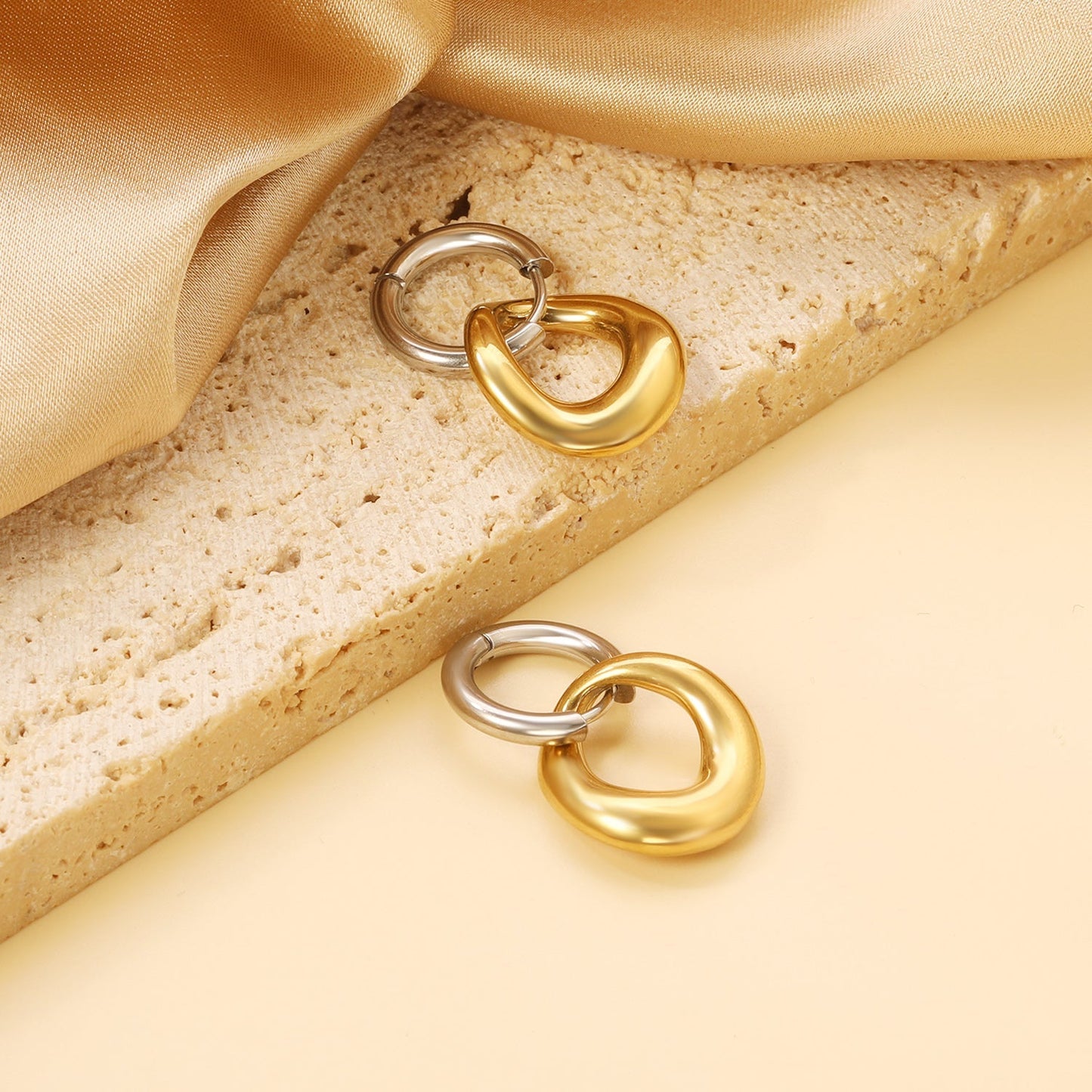Pendientes Bicolor Orbit con fusión en Oro 18K