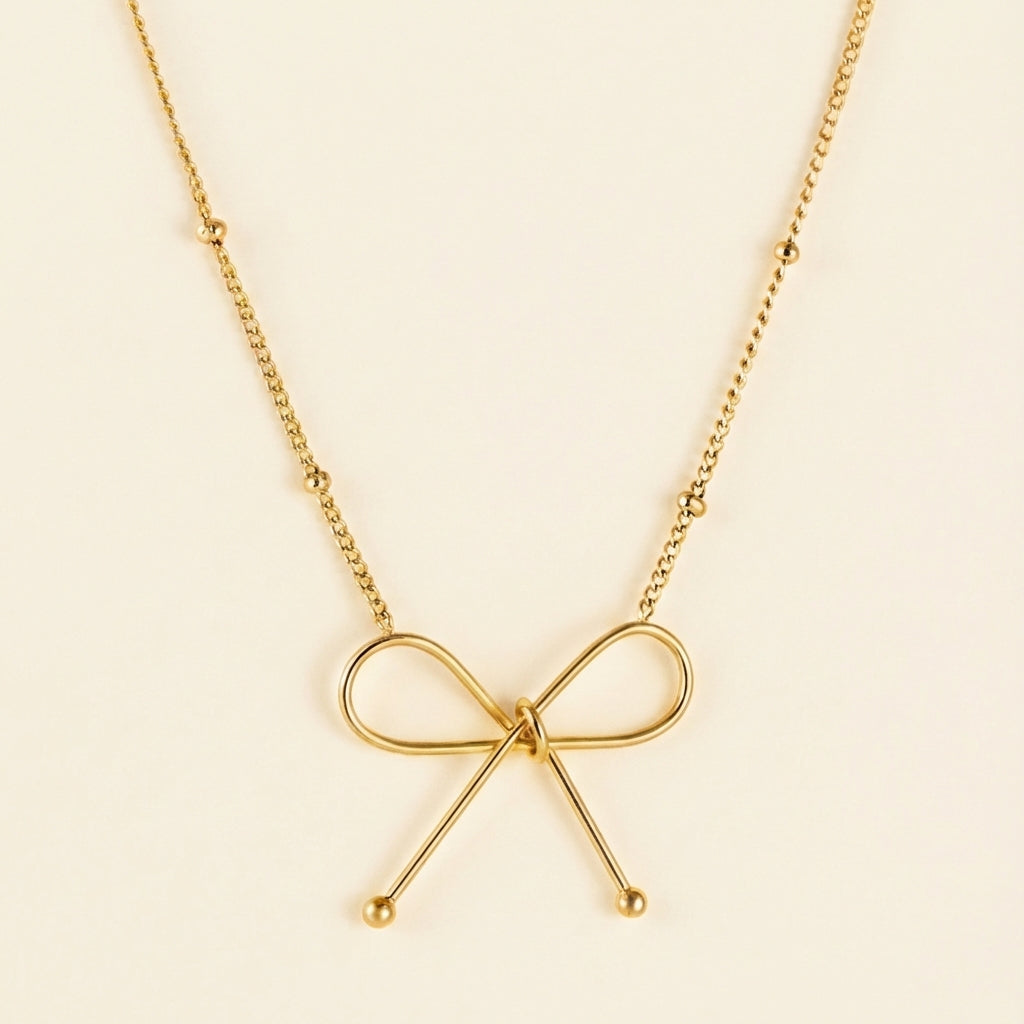 Collar Bow Pendant con fusión en Oro 18K