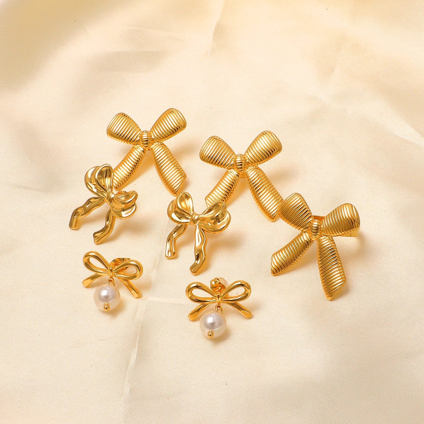 Pendientes Bow Silk con fusión en Oro 18K